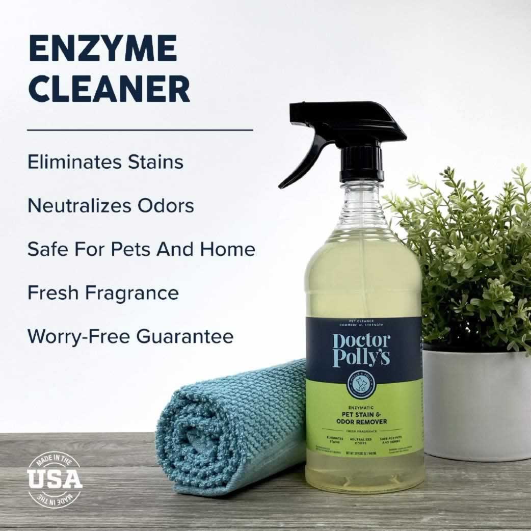 A bottle of Dr. Polly's Stain & Odor Remover on a table next to a cloth and a plant. The text reads, "Enzyme Cleaner, Eliminates Stains, Neutralizes Odors, Safe for Pets and Home, Fresh Fragrance, Worry-Free Guarantee."