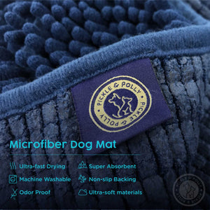 A close-up view of the product tag on a Pickle & Polly Microfiber Pet Mat. The text reads, "Microfiber Dog Mat. Ultra-Fast Drying, Super Absorbent, Machine Washable, Non-Slip Backing, Odor Proof, Ultra-Soft Materials."