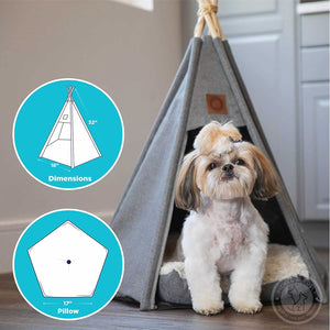 A Lhasa Apso dog sitting in a Pickle & Polly Pet Teepee Bed (Gray). The teepee measures 18 inches long on the pentagonal base with 32 inch poles. The removable cushion is 17 inches long on the pentagonal base.